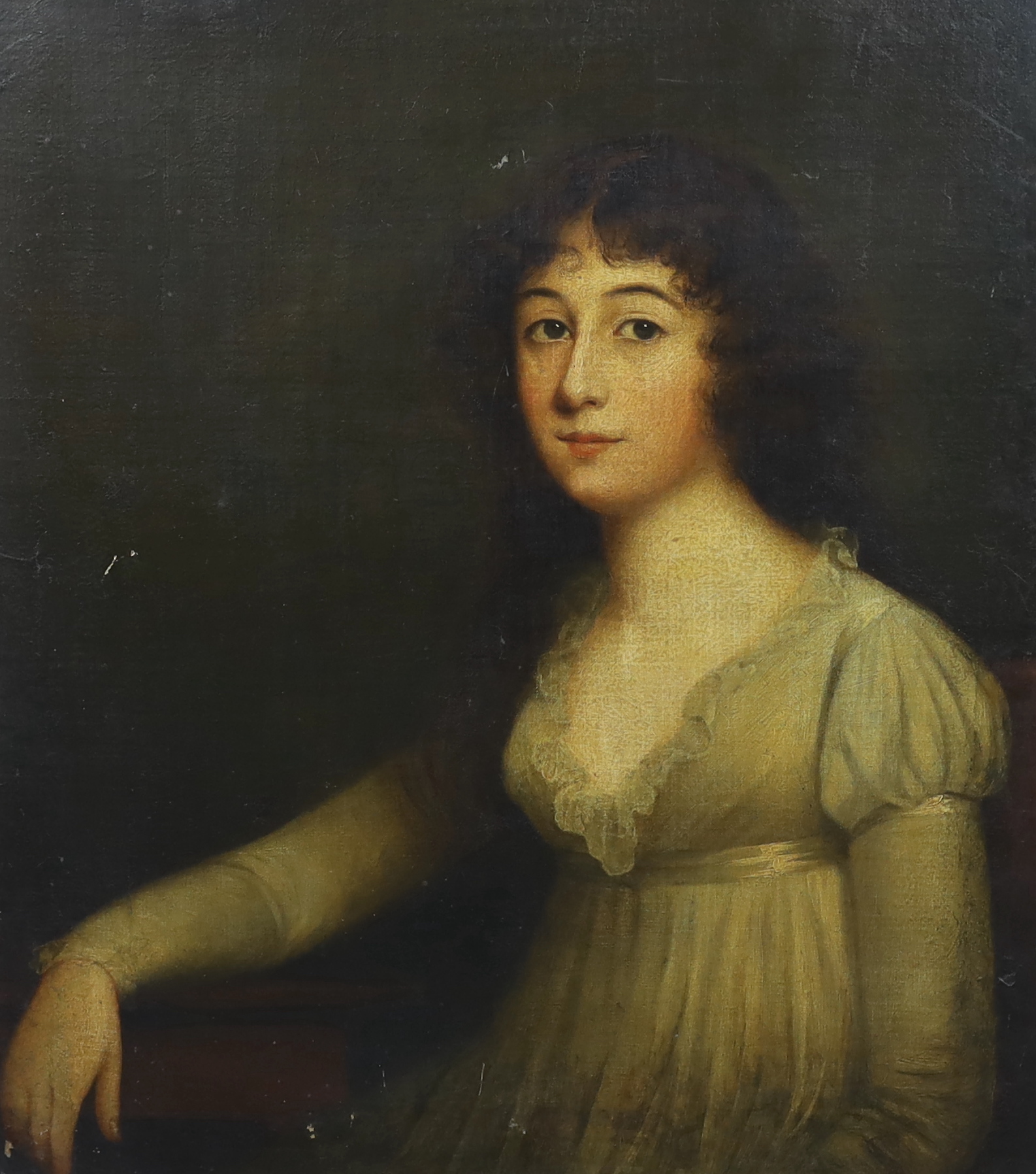Late 18th century English School, Half length portrait of a young lady, seated with her arm resting upon a table, oil on canvas, 74 x 64cm